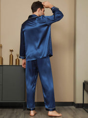 Men's mulberry silk long sleeve pajamas set in navy blue with white piping.