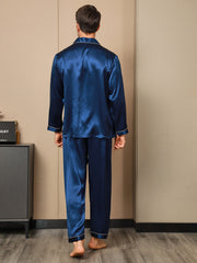 Men's navy blue mulberry silk long sleeve pajamas set with notch collar and button-up design.