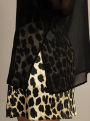 Black sheer mulberry silk long sleeve blouse over leopard print silk top.