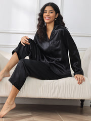 Black 100% Mulberry Silk Long Sleeve Women's Pajamas Set on a model, featuring a collared top and pants.
