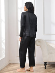 Women's black 100% mulberry silk long sleeve pajamas set, seen from behind.