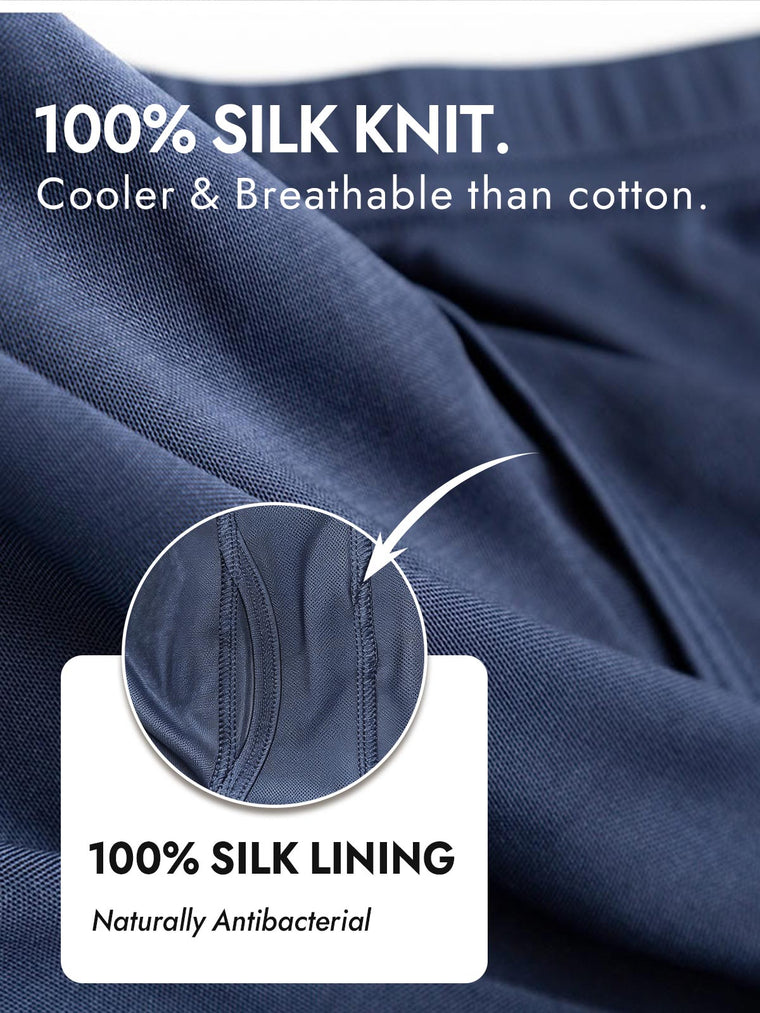 Navy blue mulberry silk knit men's underwear, close-up showing fabric texture and front opening detail.