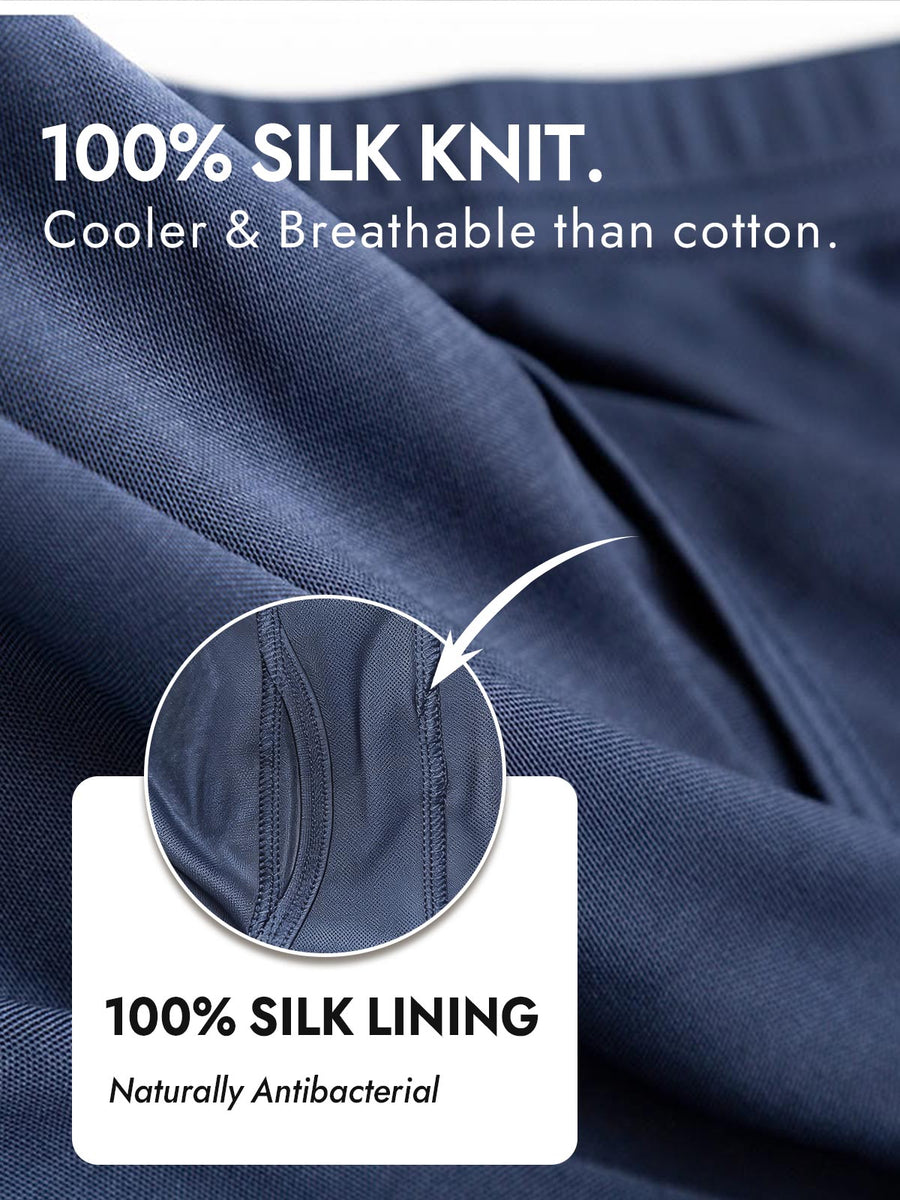 Navy blue mulberry silk knit men's underwear, close-up showing fabric texture and front opening detail.