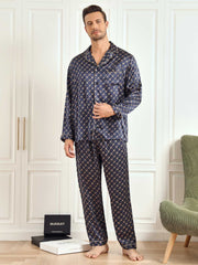 Men's navy mulberry silk pajama set with chain print, long sleeves, and gold piping.