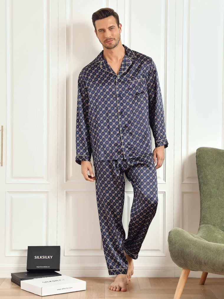 Men's navy mulberry silk pajamas with chain print, long sleeves, and gold piping.