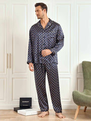Men's navy mulberry silk pajama set with chain print, long sleeves, and pants.