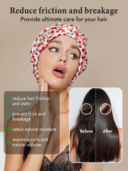 Woman wearing a white mulberry silk night turban bonnet with red cherry print, protecting her hair.
