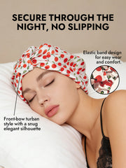 White mulberry silk night turban bonnet with red cherry pattern and front-bow design.