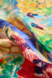 Mulberry silk square scarf with vibrant oil painting abstract design in red, blue, green, and yellow.