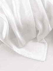 White mulberry silk pillowcase with a smooth, luxurious sheen and envelope closure.