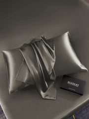Dark gray mulberry silk pillowcase with envelope closure and matching silk fabric.