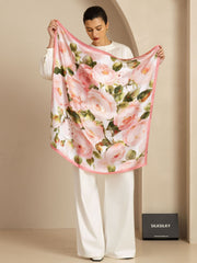 Pink floral print mulberry silk square scarf, 90x90cm, held by a woman in white.