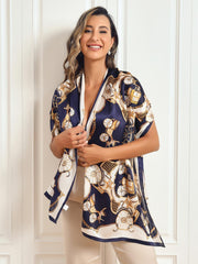 Woman wearing a navy and white mulberry silk long rectangle shawl scarf with a gold carriage print.