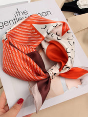 Mulberry silk printed designer square scarf, 53x53cm, with orange, white, and brown geometric patterns.