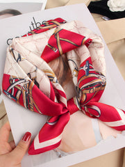 Red and cream mulberry silk square scarf with a designer chain and buckle print.