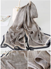 Mulberry silk long rectangle shawl scarf with a black and beige plaid pattern and striped border.