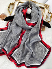 Mulberry silk long rectangle shawl scarf with black and white houndstooth print and red borders.