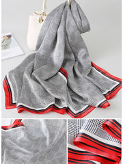 Mulberry silk printed long rectangle shawl scarf with black and white plaid pattern and red border.