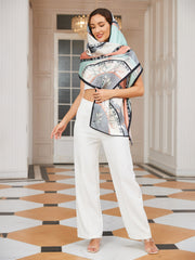 Elegant woman wearing a large, rectangular 100% mulberry silk printed shawl scarf with a floral design.