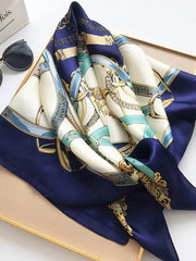 Navy blue mulberry silk square scarf with gold chain and belt print.