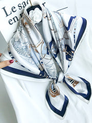 White 100% Mulberry silk square shawl scarf with a blue and brown nautical print, 88x88cm.