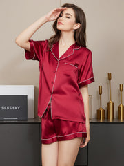 Women's mulberry silk short sleeve notch collar pajamas set in red with white piping.