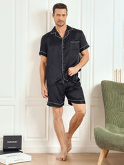Men's black mulberry silk short sleeve pajama set with white piping and shorts.
