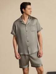 Men's grayish green mulberry silk short sleeve notch collar pajama set with shorts and white piping.