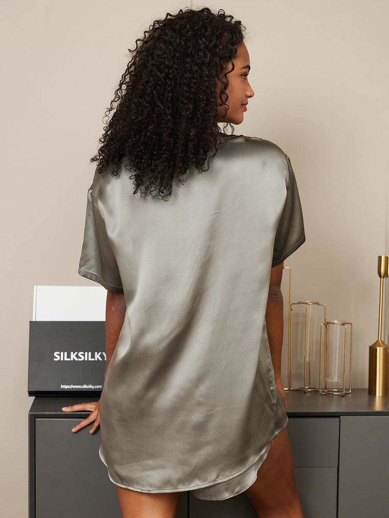 Woman in a sage green mulberry silk short sleeve round neck sleep tee.