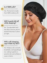 Smiling woman wearing a black 100% mulberry silk sleep bonnet with adjustable ribbons.