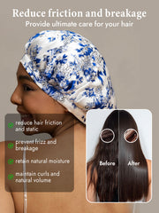 White mulberry silk sleep bonnet with blue floral pattern, shown on a woman.