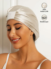 Beige 100% Mulberry Silk Sleep Cap, Double Layer Night Turban Bonnet on a woman.