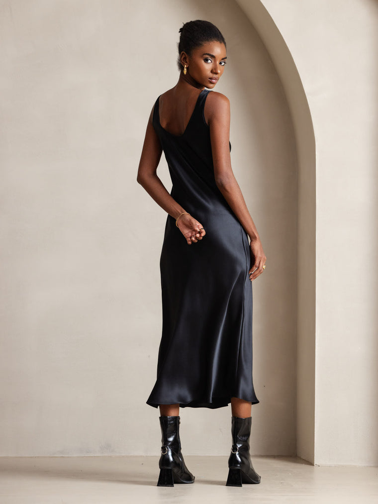 Black mulberry silk sleeveless U-neck midi dress on a model.