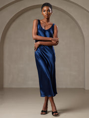 Dark blue mulberry silk sleeveless U-neck midi long dress on a model.