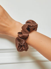 Coffee 100% Mulberry silk scrunchie on a wrist, soft large hair tie.