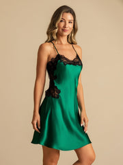 Women's emerald green mulberry silk nightgown with black lace trim and spaghetti straps.