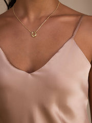 Champagne 100% Mulberry silk spaghetti strap camisole top with a subtle sheen.