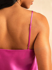 Mulberry silk spaghetti strap camisole in vibrant fuchsia, showing adjustable strap and smooth fabric.