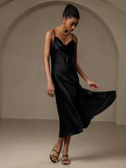 Black mulberry silk spaghetti strap cowl neck midi dress with bias cut and split design.
