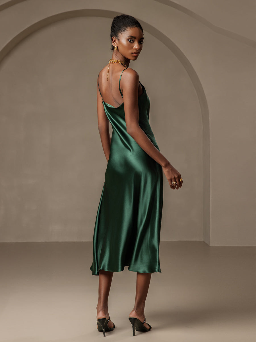 Women's emerald green mulberry silk cowl neck midi dress with spaghetti straps and split design.