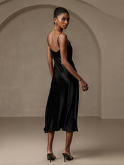 Black mulberry silk spaghetti strap cowl neck midi dress with split design.
