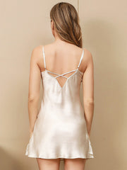 Women's ivory mulberry silk spaghetti strap nightgown with crisscross back detail and lace trim.