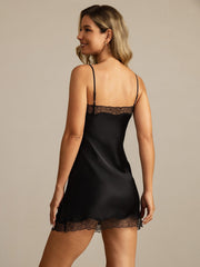 Black mulberry silk spaghetti strap nightgown with lace trim.