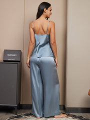 Women's mulberry silk spaghetti strap cami and wide leg pants pajama set in blue.
