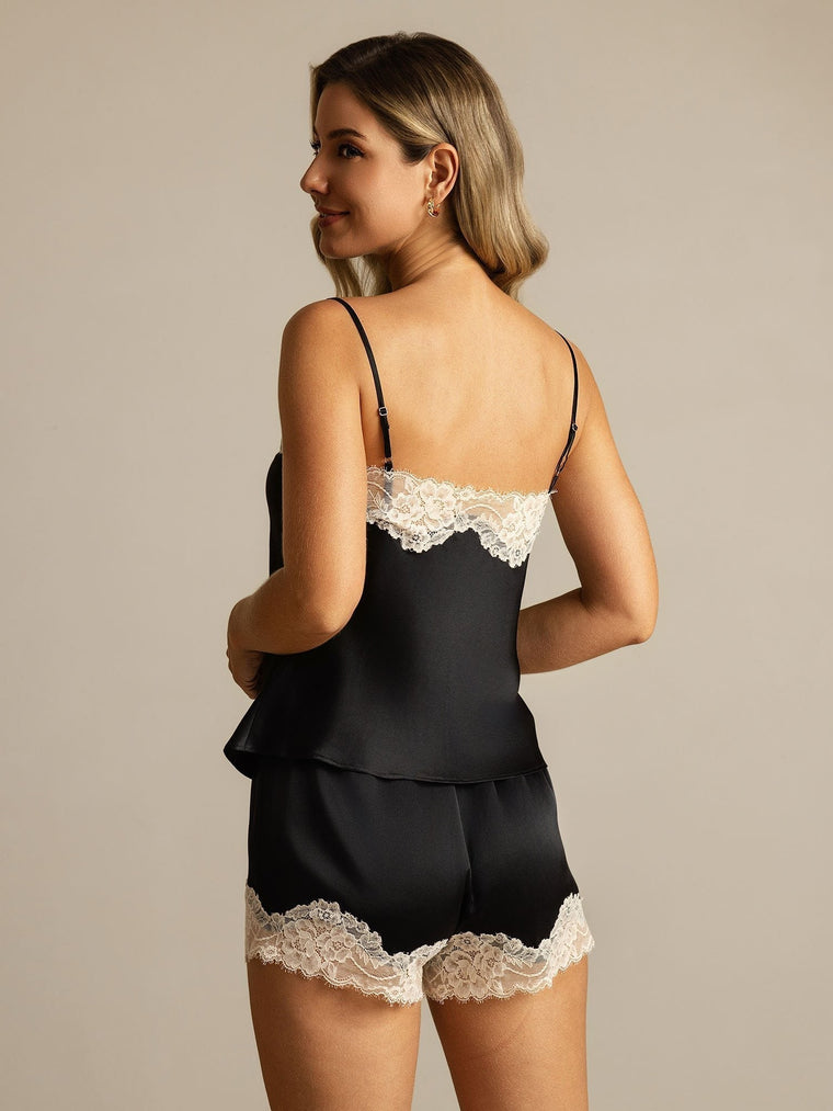 Women's black mulberry silk camisole and shorts set with white lace trim.