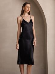Black mulberry silk midi dress with spaghetti straps and V-neck.