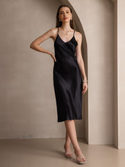 Black mulberry silk spaghetti strap V-neck midi dress with criss-cross back design.