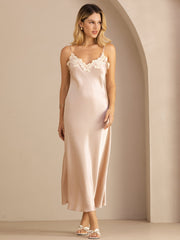 Women's blush mulberry silk midi dress with spaghetti straps and delicate lace V-neck design.