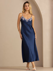 Blue mulberry silk spaghetti strap midi dress with lace V-neck and V-back design.