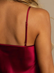 Women's red mulberry silk spaghetti strap V-neck nightgown, close-up of adjustable strap.
